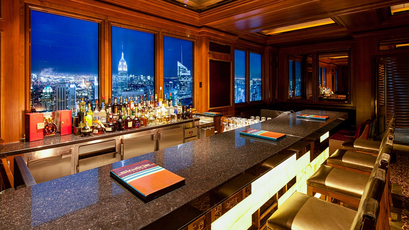 The panels behind a granite bar show a mural designed to create a convincing cityscape view