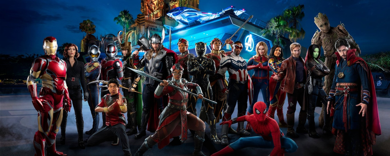 A large group of Marvel Super Heroes in front of Avengers Headquarters
