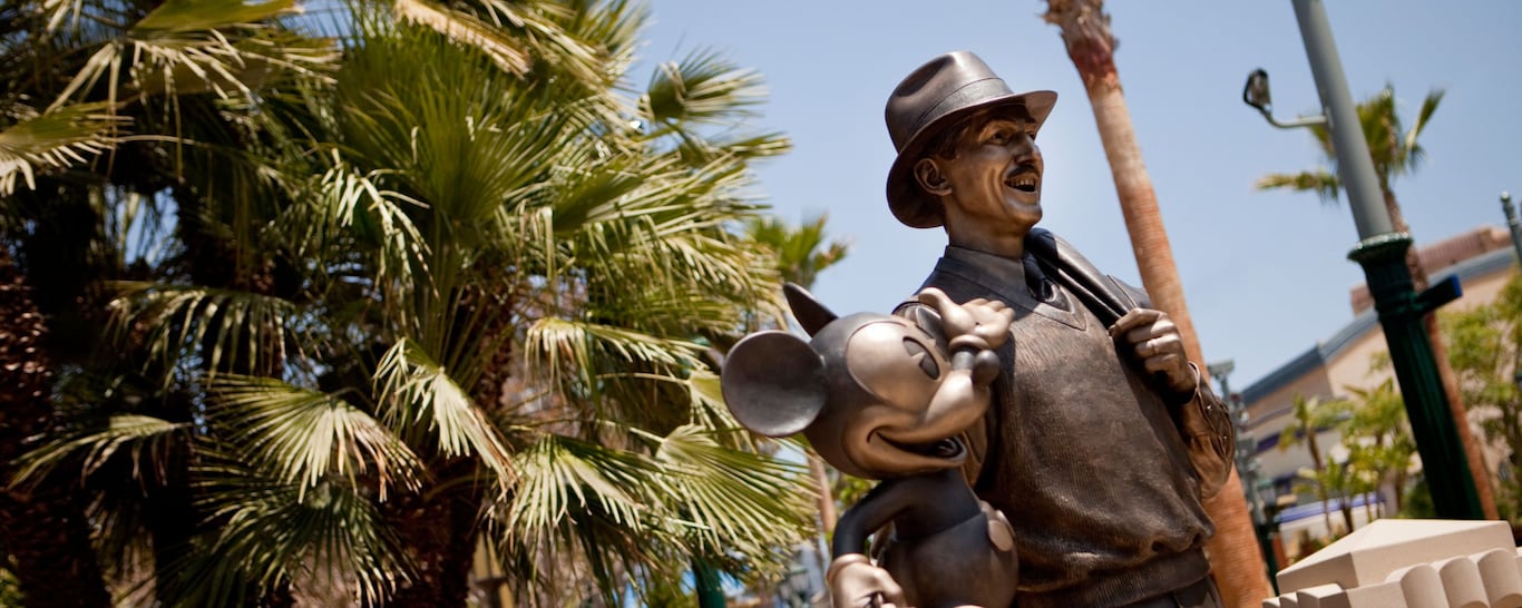 A bronze statue of Walt Disney and Mickey Mouse at Disney California Adventure Park