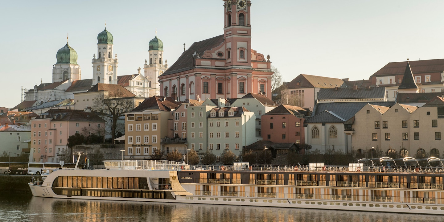 An AmaWaterways ship cruises along the Danube River past the town of Passau, Germany An AmaWaterways ship cruises along the Danube River past the town of Passau, Germany
