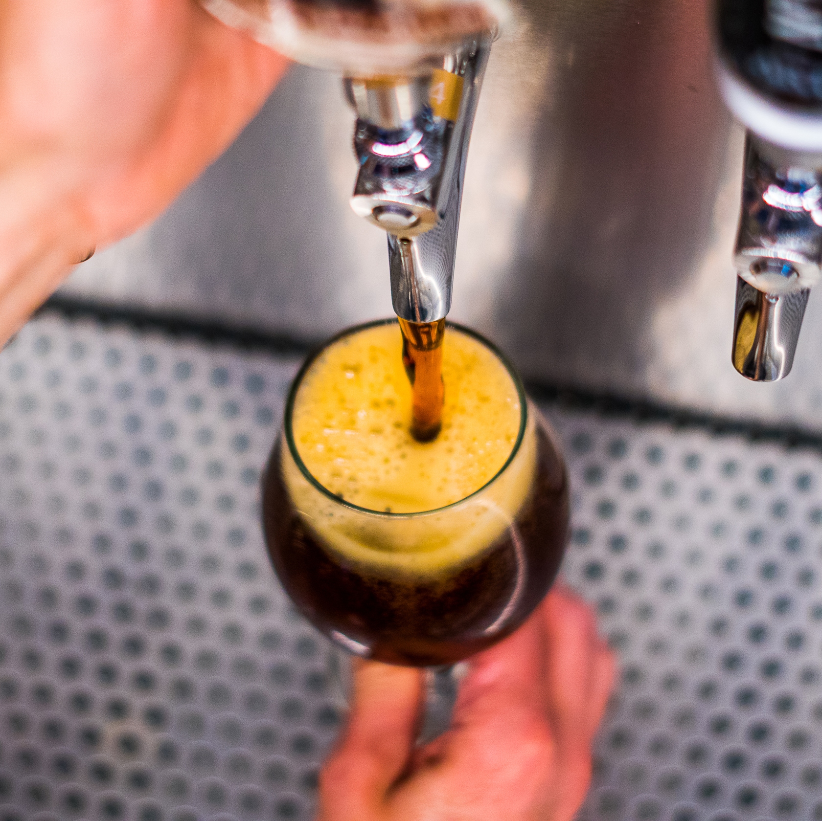 undefined slide 58 of 12 Beer pouring out of a spout into a glass