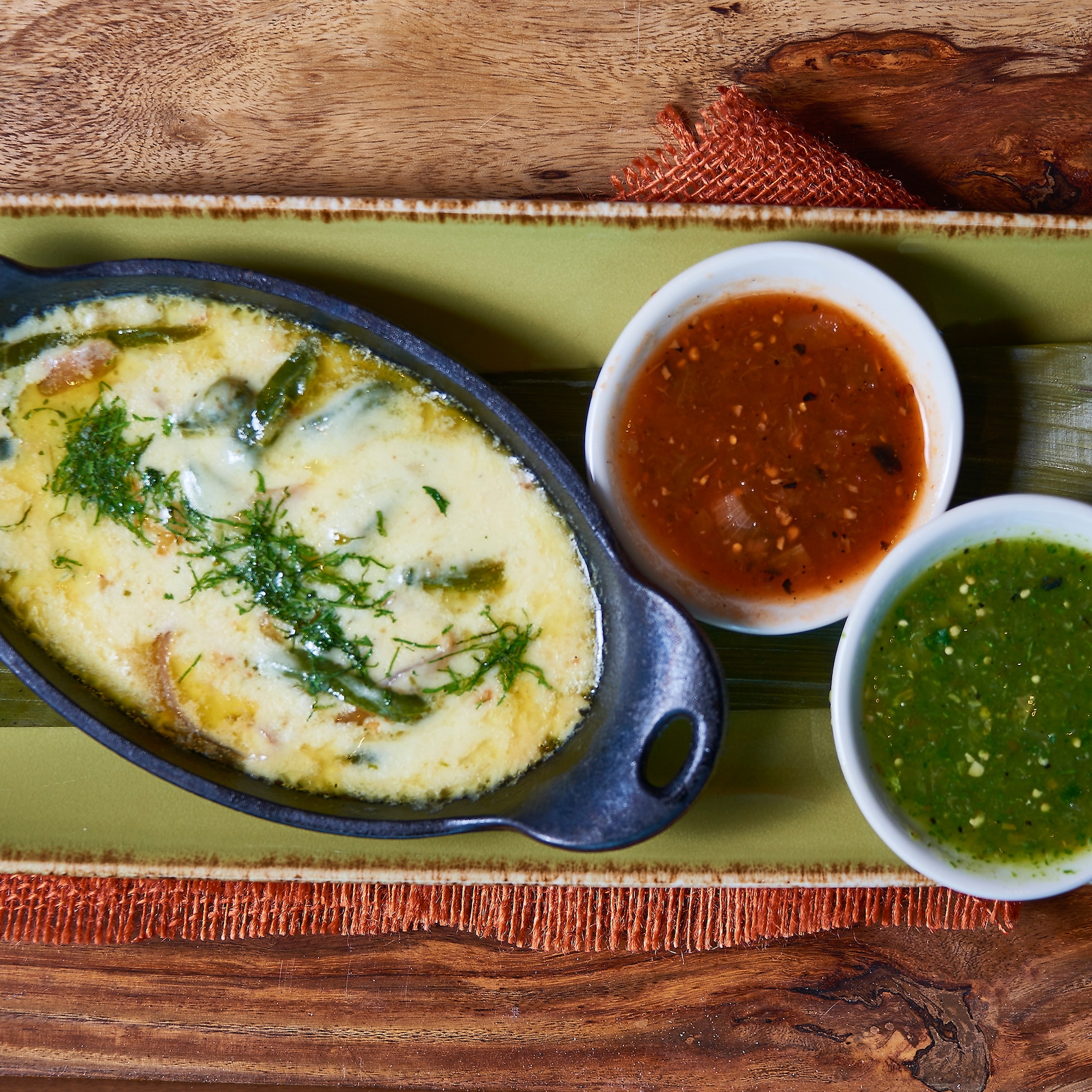 Feast on muy delicioso starters like the Queso Fundido—made with queso Chihuahua melted with roasted poblanos and caramelized onions. Arrives to your table with warm corn tortillas. slide 72 of 16 A melted cheese dish with roasted poblanos and caramelized onions is served with 2 types of salsa
