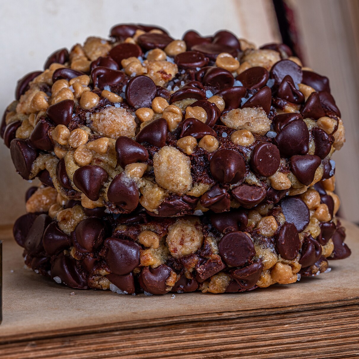 Two Chocolate Peanut Butter Swirl Cookies stacked on a book