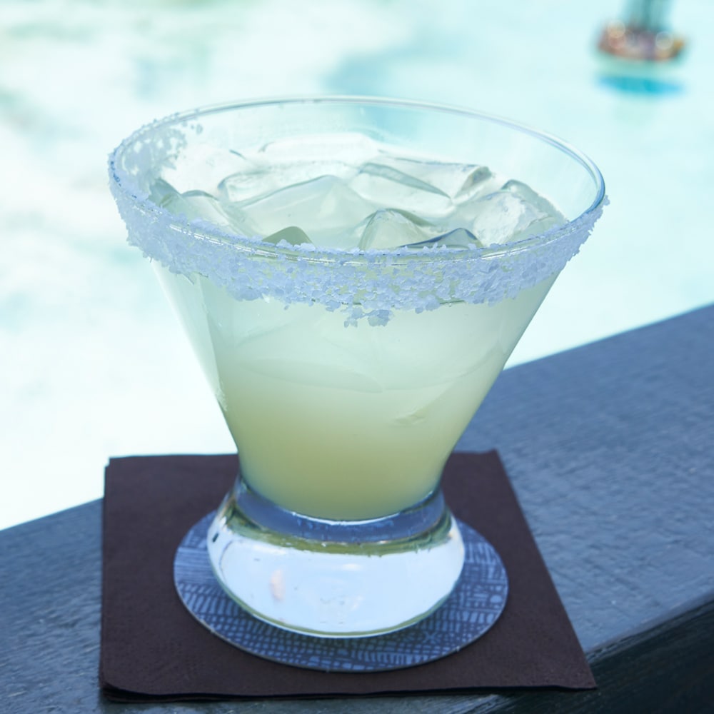 Unwind after a day of shopping and sightseeing with a classic margarita on the rocks with salt. slide 77 of 16 Margarita on the rocks with a salt rim