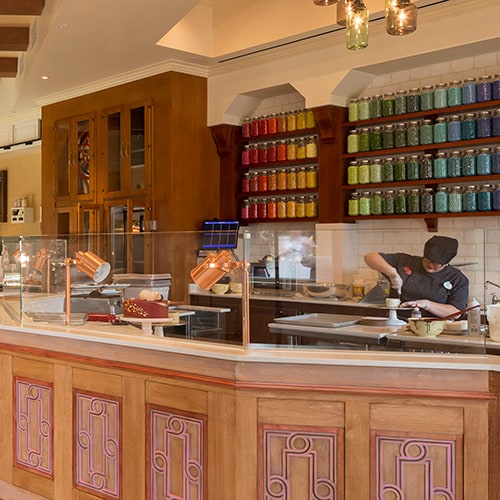 Sit and savor one of our signature pastries or order one of our magnificent cake masterpieces to go. slide 19 of 4 The interior of Amorette’s Patisserie with clerks working behind serving counters, round tables with displays of confections out front and, against the rear wall, menu boards, a large wooden cabinet and shelves holding glass jars of jelly beans The interior of Amorette’s Patisserie with a clerk working behind a serving counter and, behind her, a large wooden cabinet and shelves holding glass jars of jelly beans