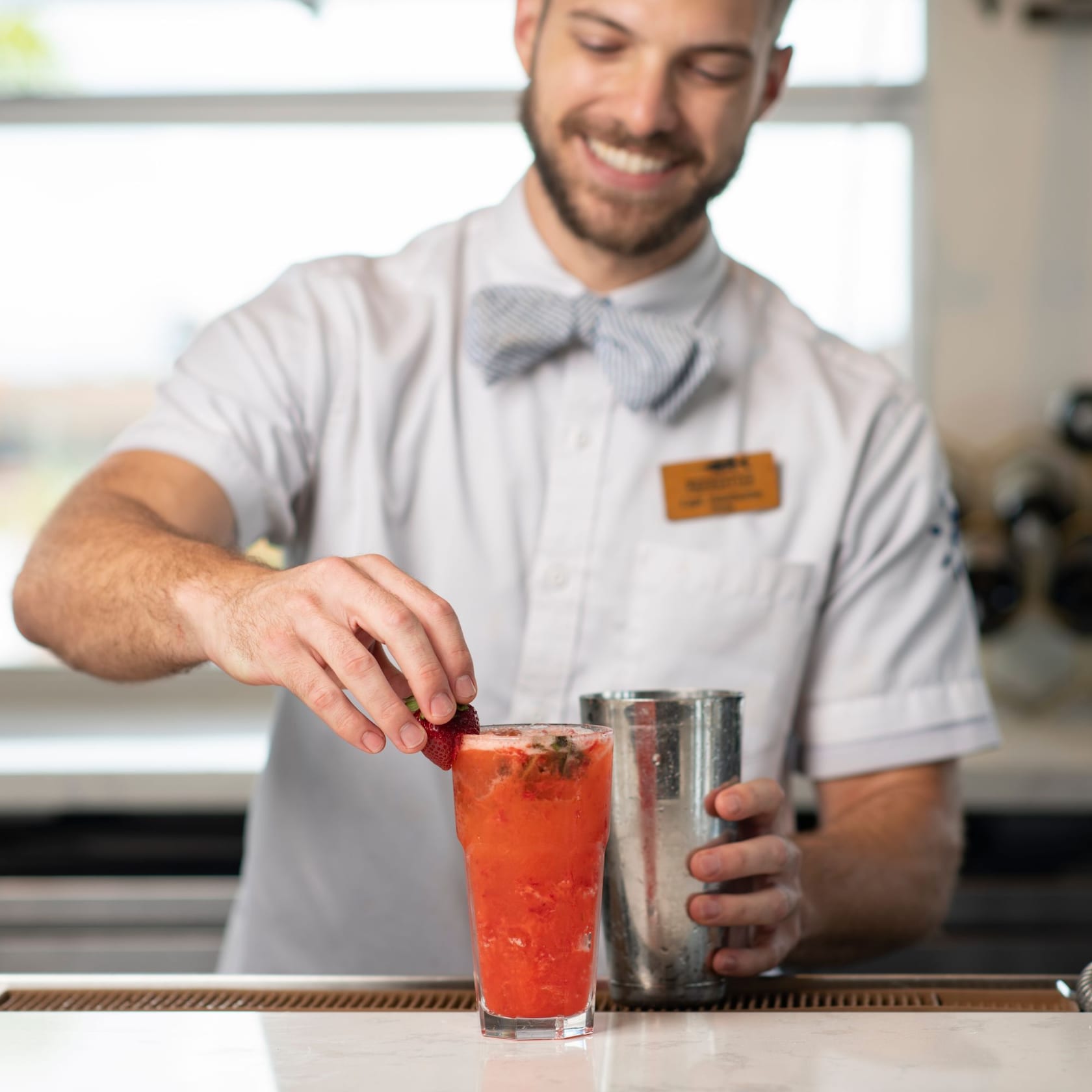 Quench your thirst with a tasty libation, like Strawberry Basil Lemonade. slide 30 of 6 A Cast Member prepares a glass of refreshing Strawberry Basil Lemonade