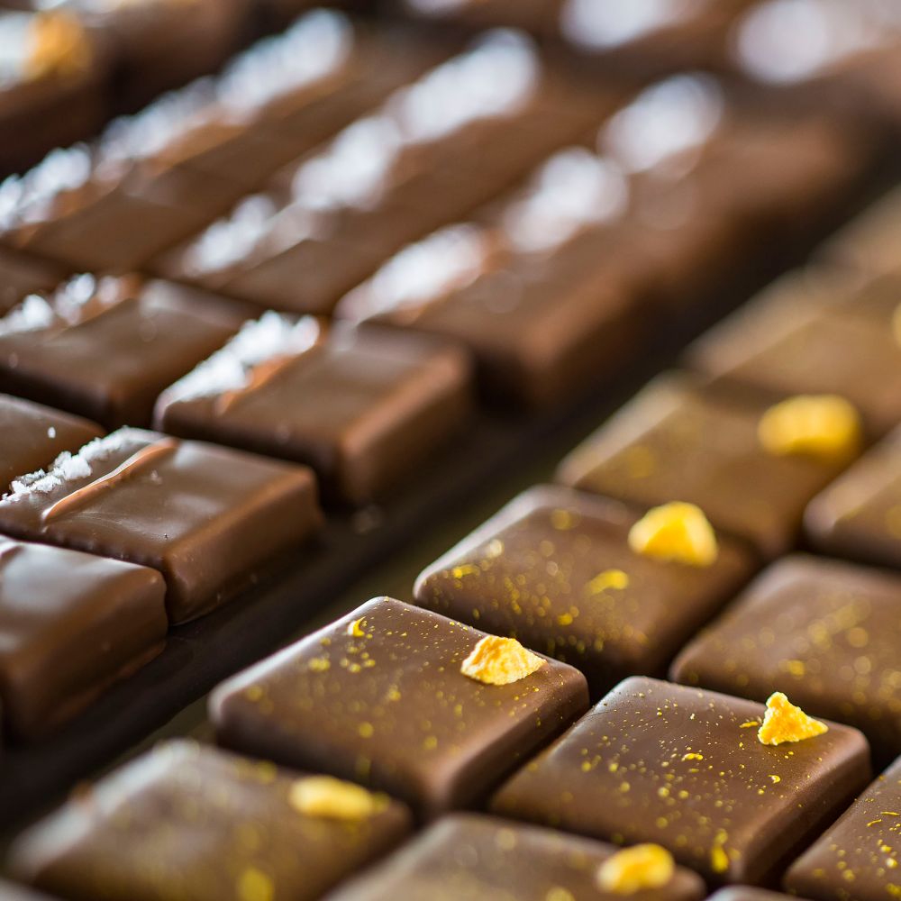 Indulge in decadent ganache squares, available in a wide variety of flavors. slide 22 of 5 Several rows of chocolate ganache squares