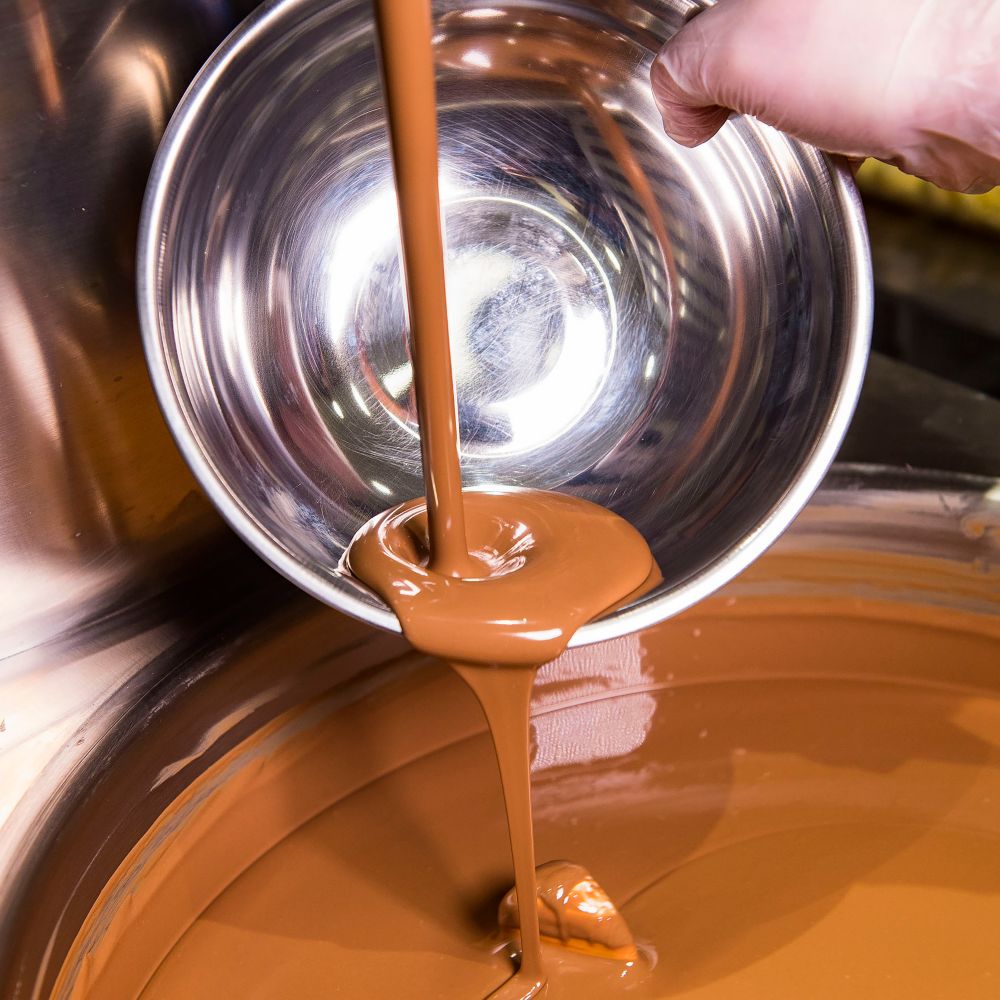 Each ganache treat is made from scratch using the finest ingredients, including custom chocolate blends. slide 24 of 5 Chocolate sauce being poured into a bowl