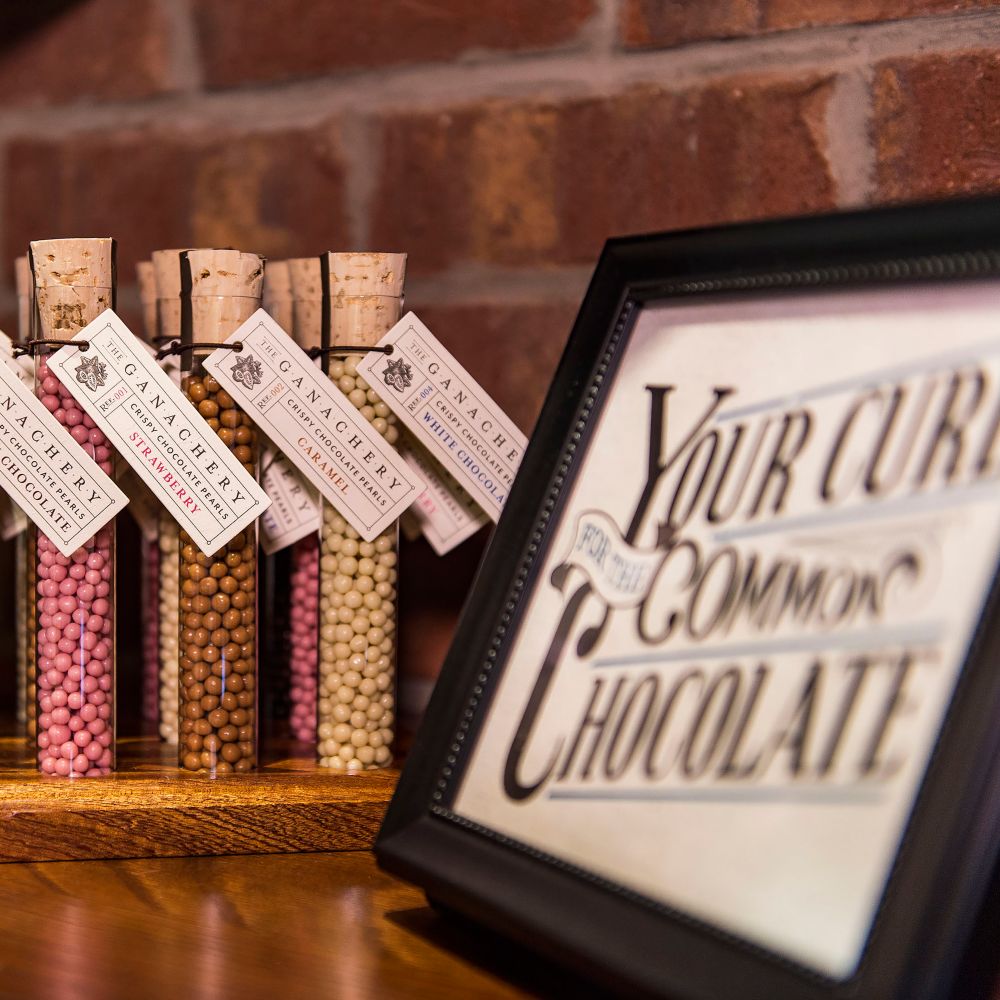 Pick up beautifully packaged candies to enjoy later—or share with someone special. slide 25 of 5 Several jars filled with candy pearls