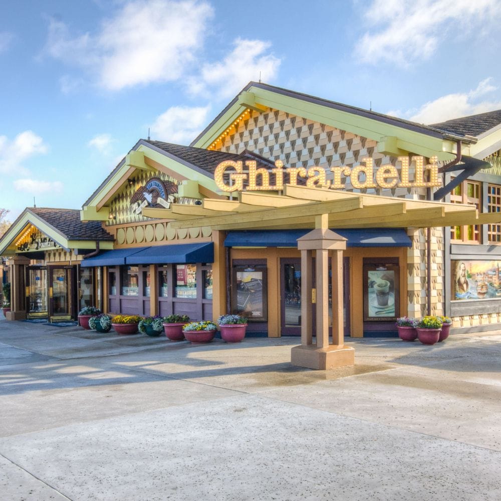 Stop by Ghirardelli Soda Fountain and Chocolate Shop for specialty sundaes and premium chocolates. slide 25 of 6 A building with a sign that says, ‘Ghirardelli’