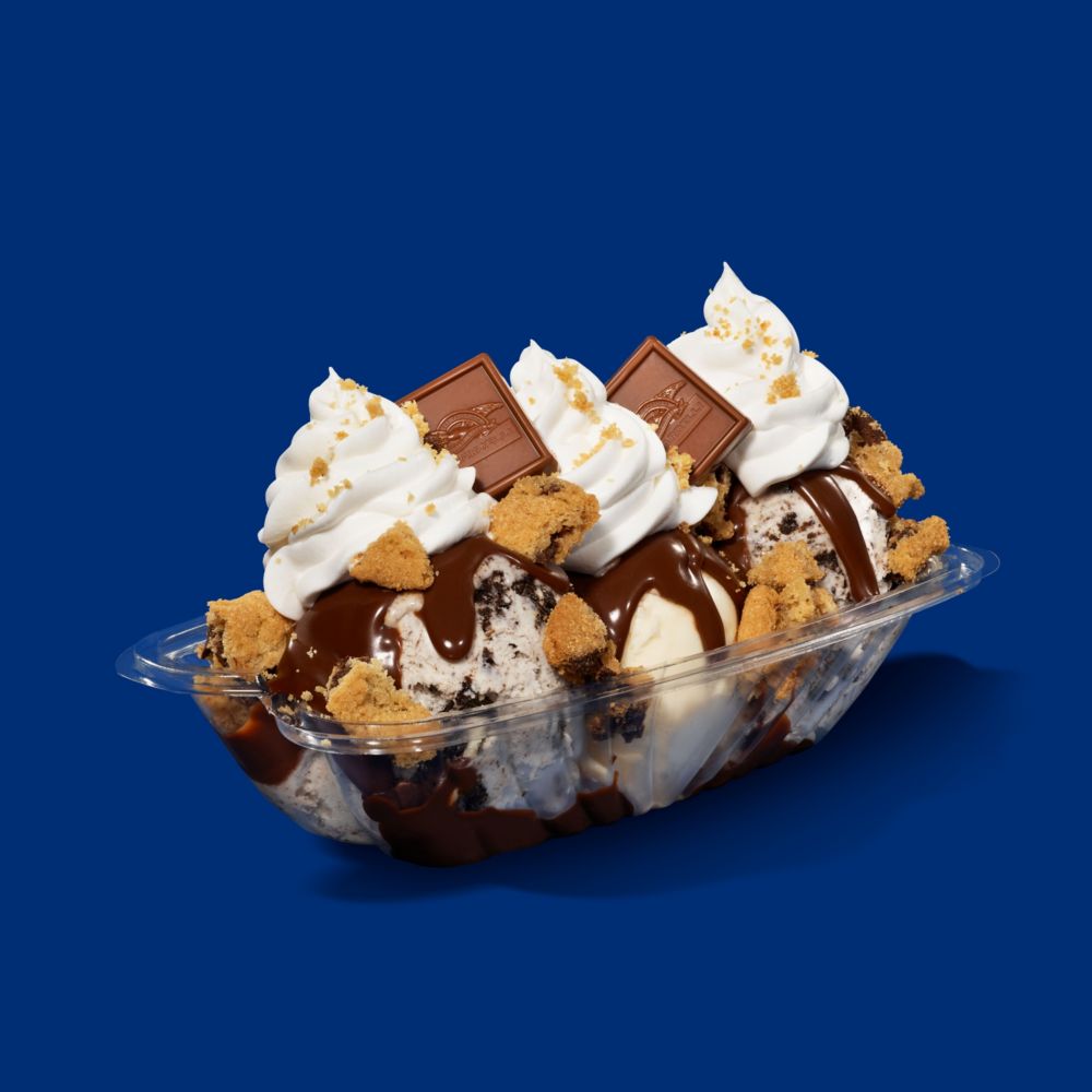 Calling all cookie lovers—enjoy a twist on your favorite dessert when you order the Cookie Crumble Hot Fudge Sundae. slide 29 of 6 A sundae with vanilla ice cream, hot fudge, whipped cream, chocolate chip cookie crumbles and chocolate squares