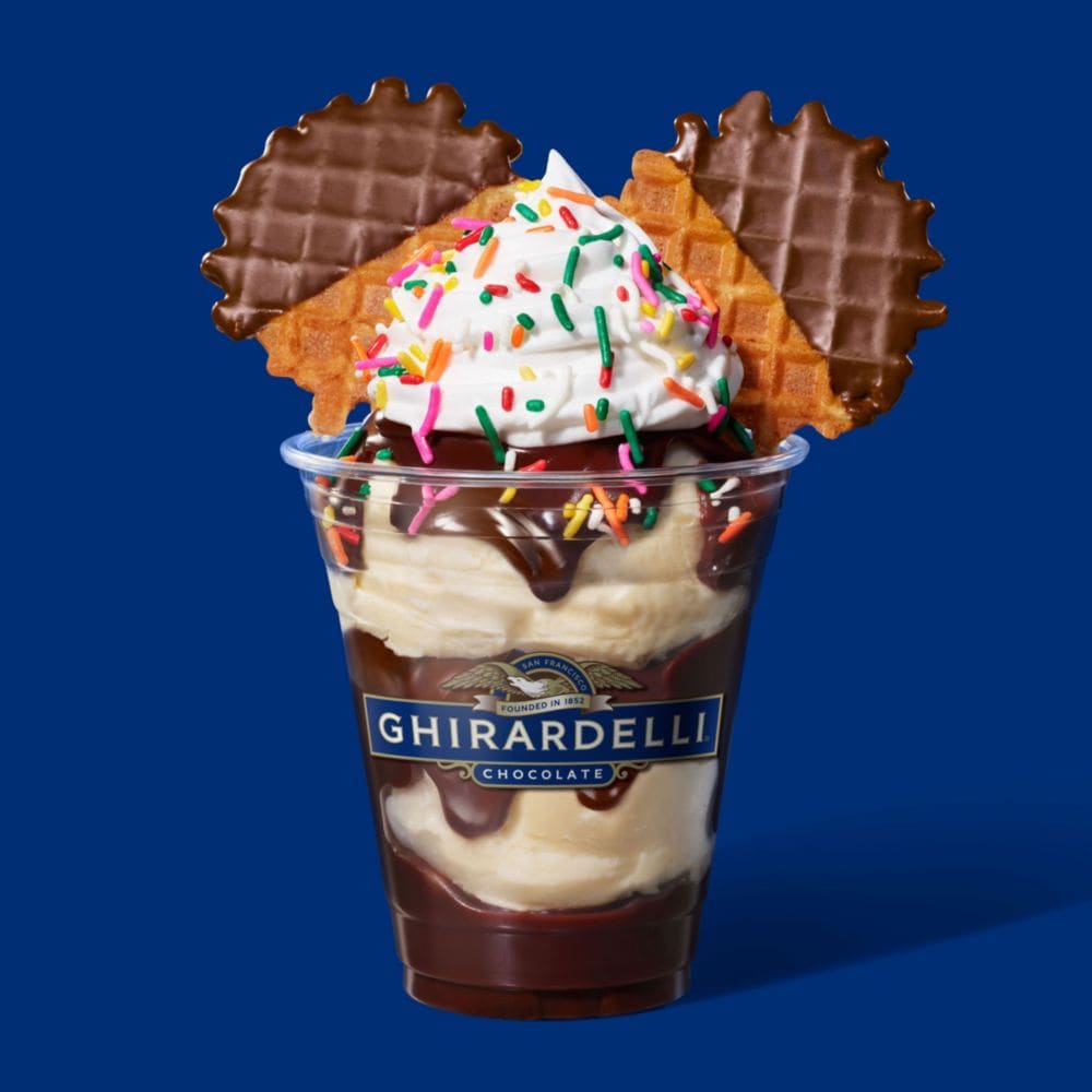 Indulge in the Magical Hot Fudge Sundae—a tasty treat presented with Disney flair. slide 26 of 6 Vanilla ice cream topped with hot fudge, whipped cream, sprinkles and waffle cones in the shape of Mickey Mouse ears