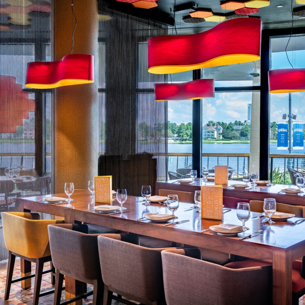Set tables near the windows at Jaleo by José Andrés at Disney Springs