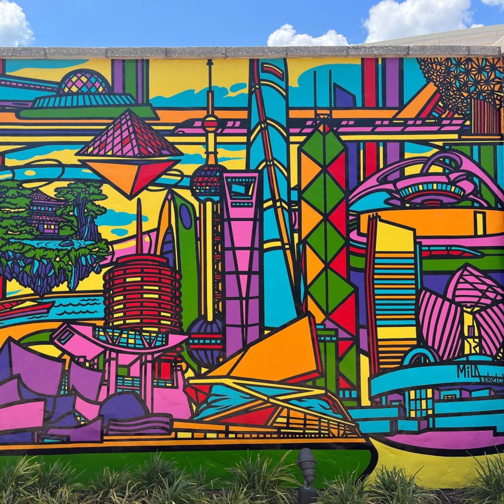 A mural featuring buildings from cities around the world 