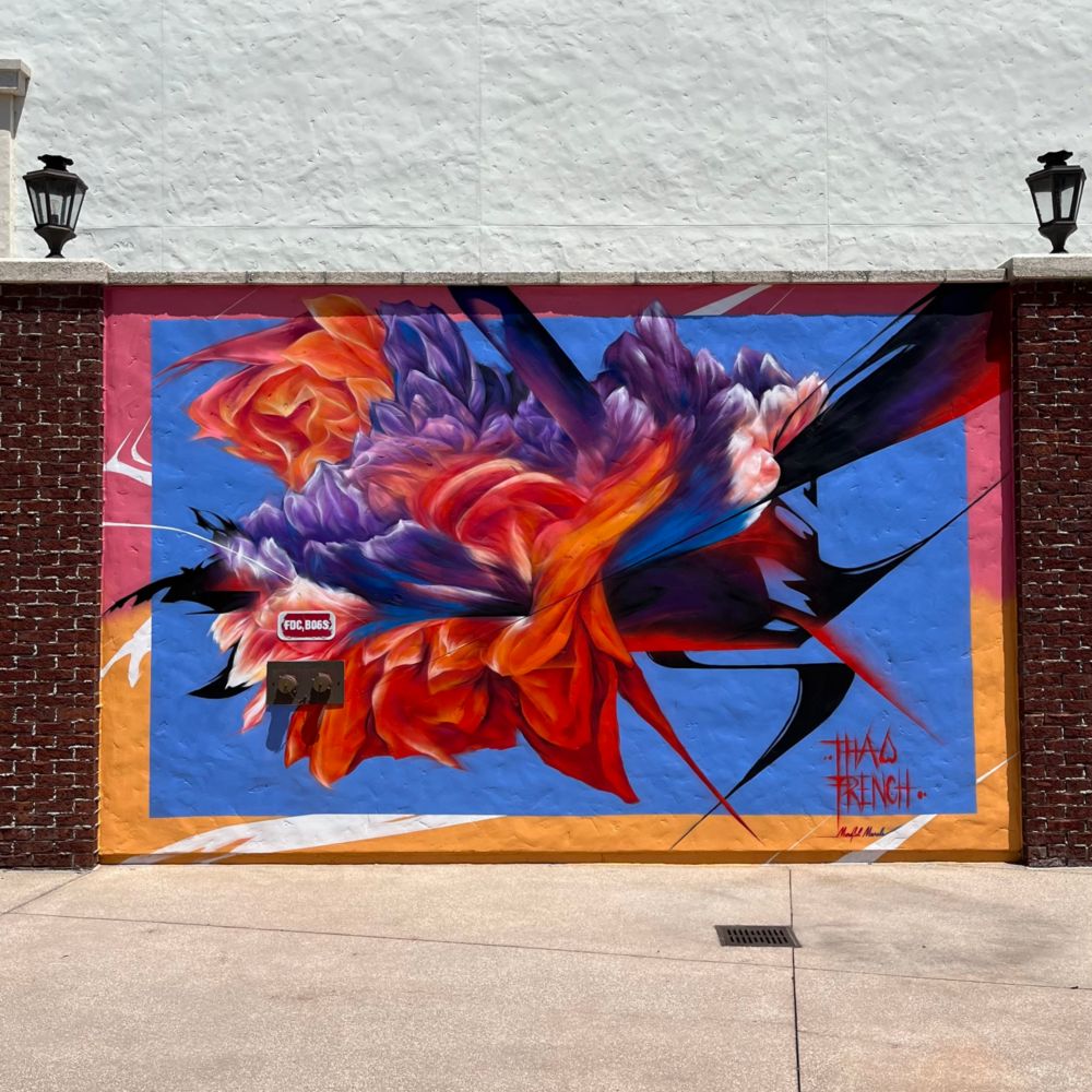 An abstract mural of a flower painted on a wall in Disney Springs at Walt Disney World Resort