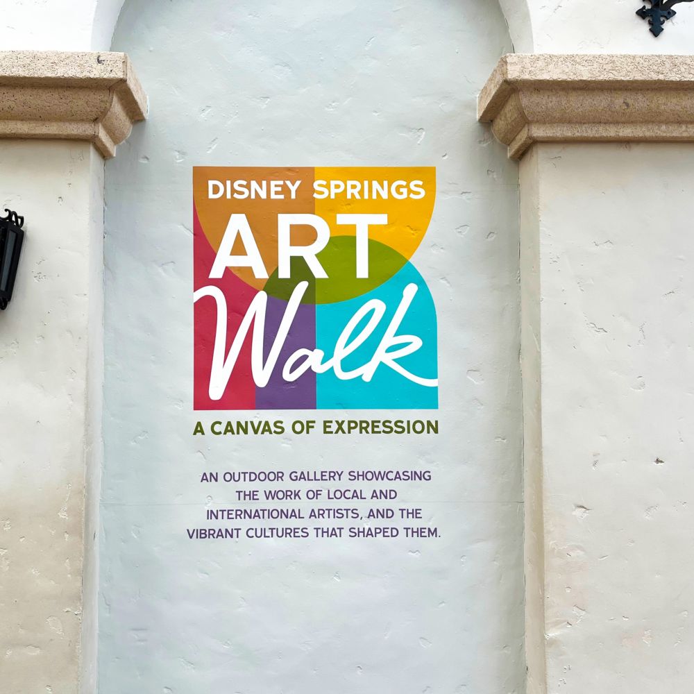 The Art Walk logo over a blank wall with text beneath reading ‘A Canvas of Expression’