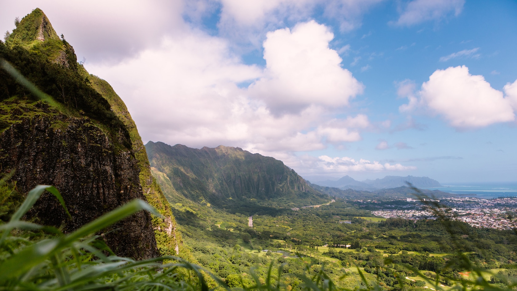 Tropical forests on mountains overseeing a lush valley