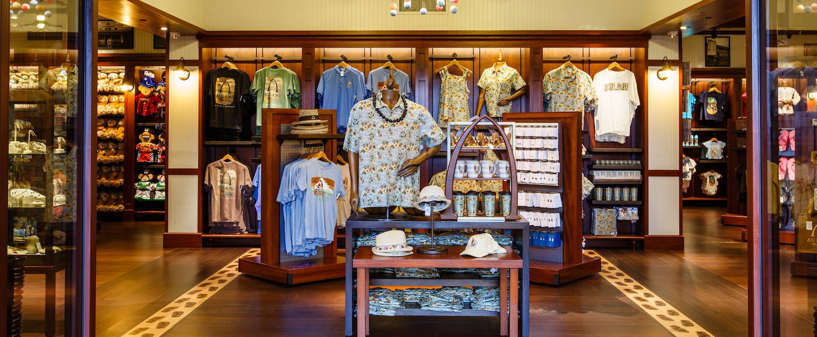Disney-themed resort wear, mugs and jewelry displays inside Kalepa's Store, the Aulani Resort lobby gift shop