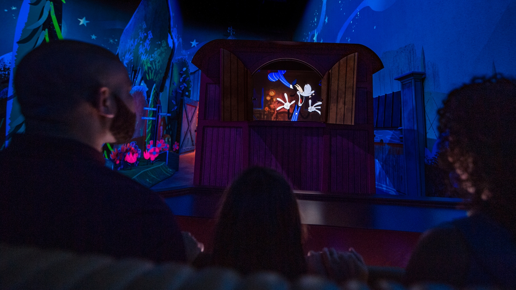 Engineer Goofy standing in a train car