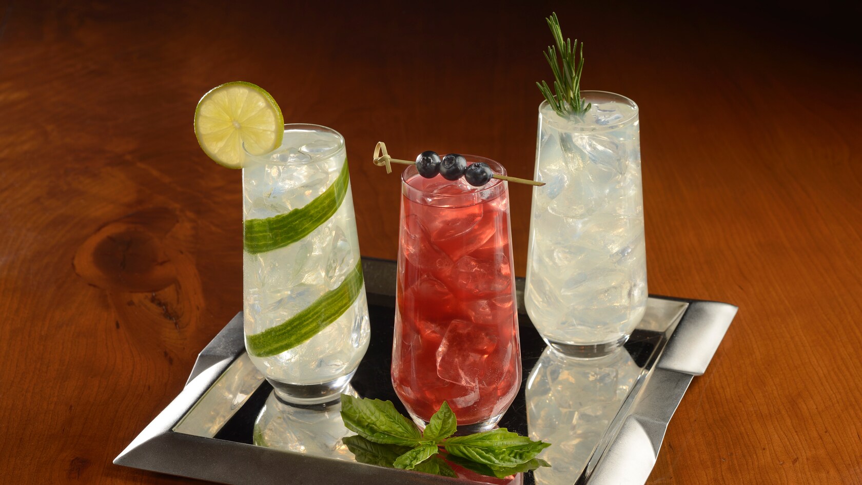 Three iced beverages on a tray    