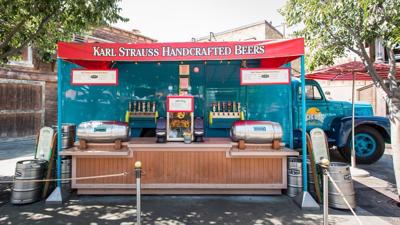 A sign atop a kiosk identifies it as Karl Strauss Handcrafted Beers