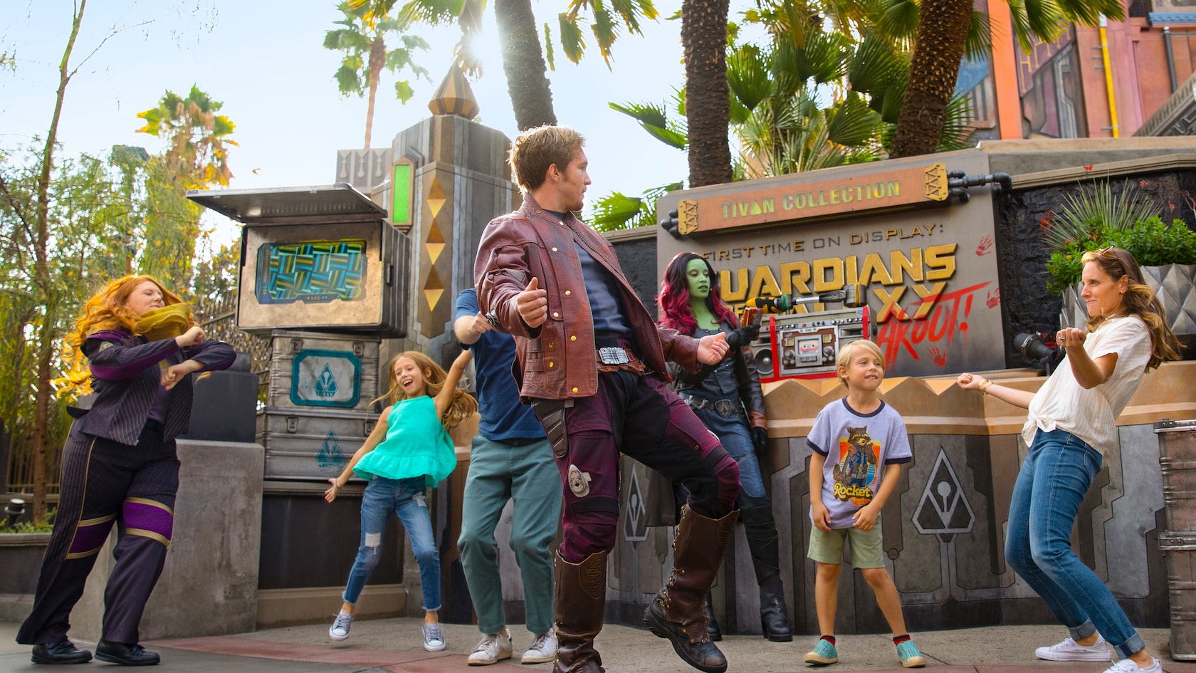 A girl dances with Star Lord, Gamora and other characters from Guardians of the Galaxy