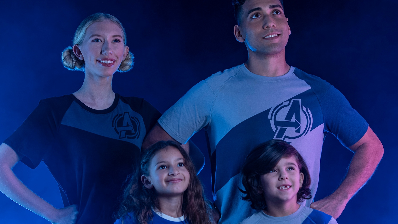 A family poses in Avengers t-shirts