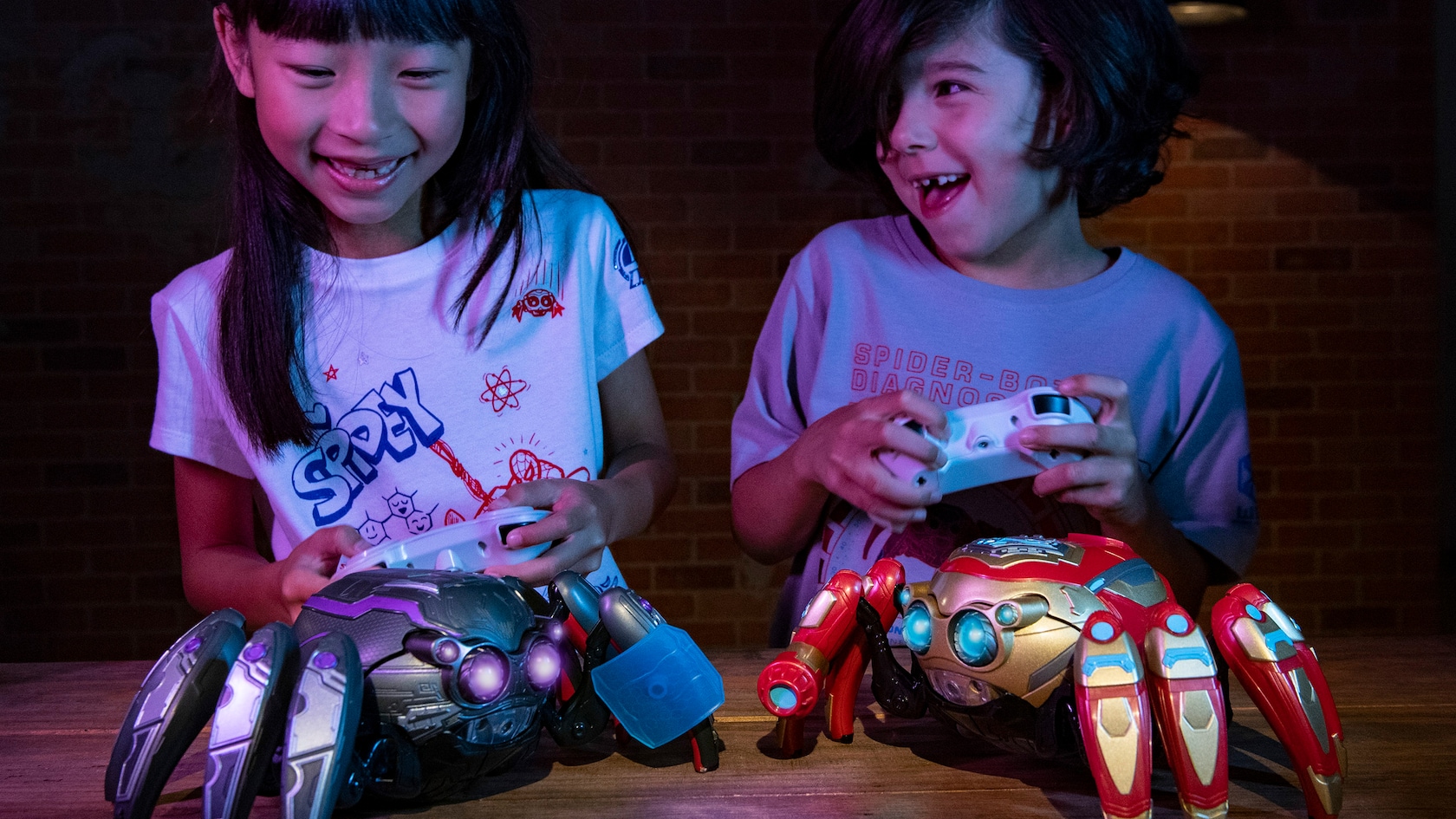 2 kids show off their Spider-Bots