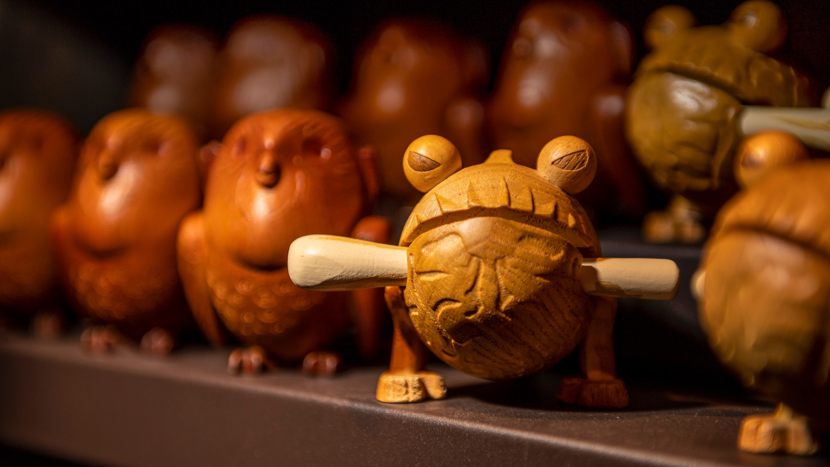 A handcrafted wooden frog dog available for purchase at Toydarian Toymaker.