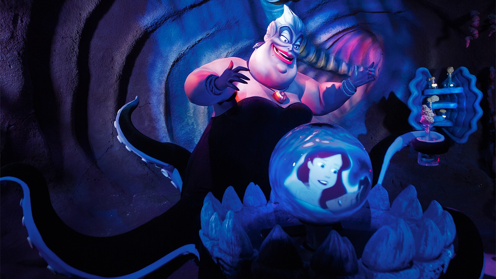 Ursula, the Sea Witch, gazes into her crystal ball and sees Ariel