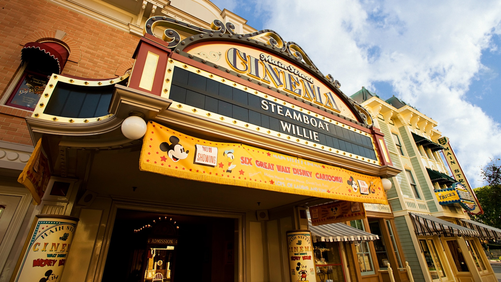 Main Street Cinema marquee: Now Showing Steamboat Willie and Six Great Walt Disney Cartoons!