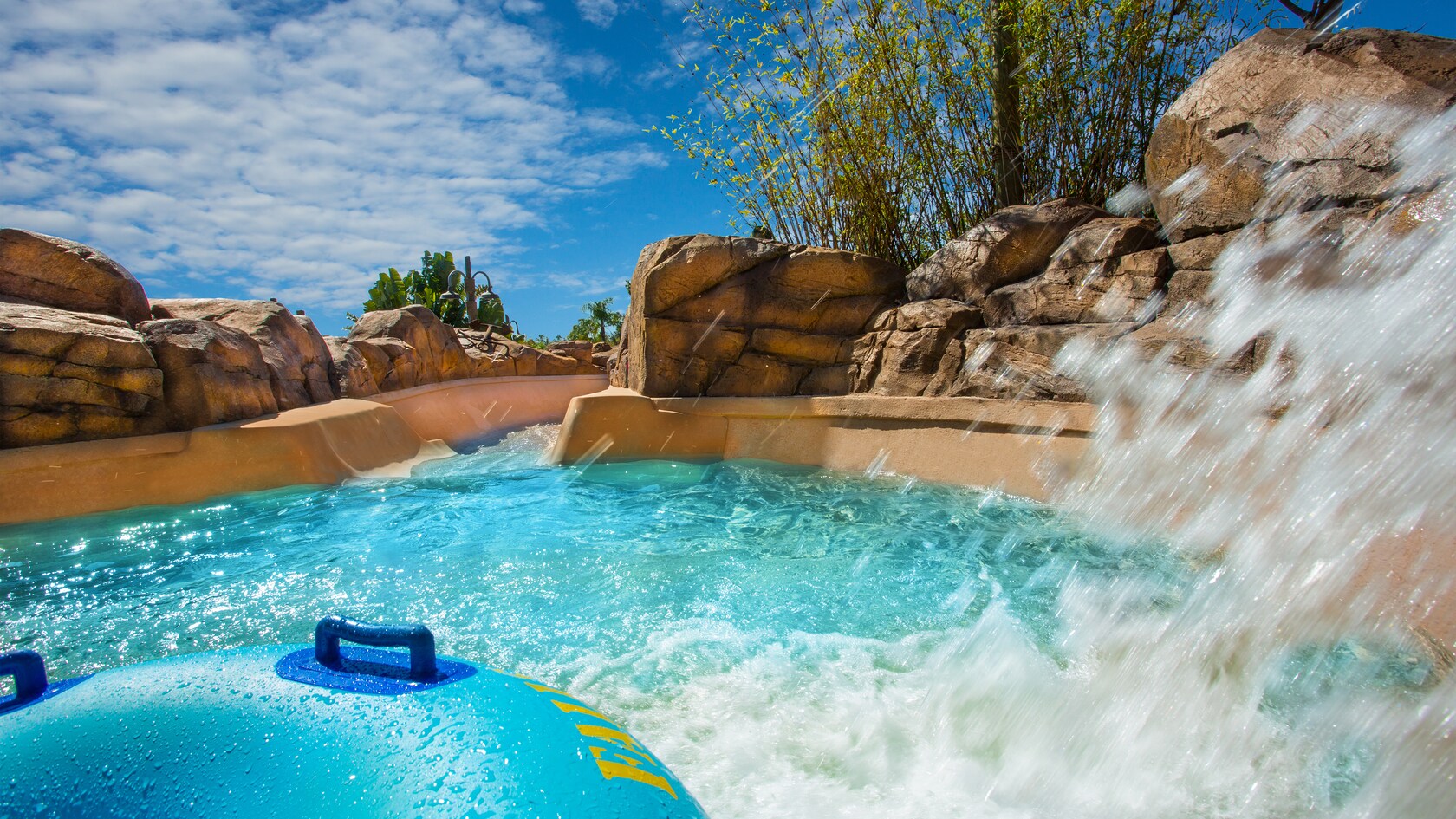 A raft splashes through the water at Keelhaul Falls in Disney's Typhoon Lagoon water park