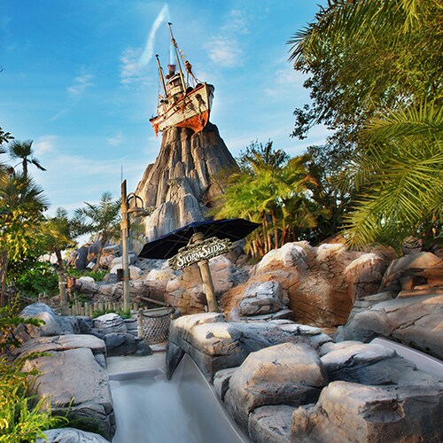 One of the 3 waterslides at Storm Slides with the Miss Tilly shrimp boat atop Mount Mayday beyond