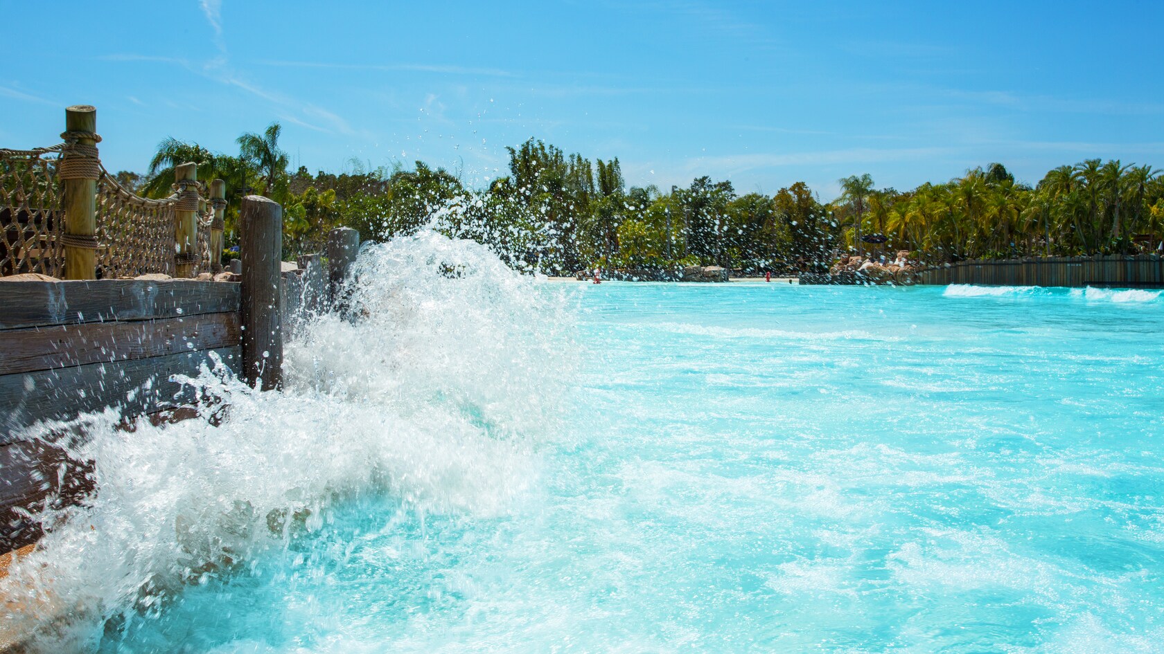 A wave crashes against a seawall at Disney's Typhoon Lagoon Surf Pool