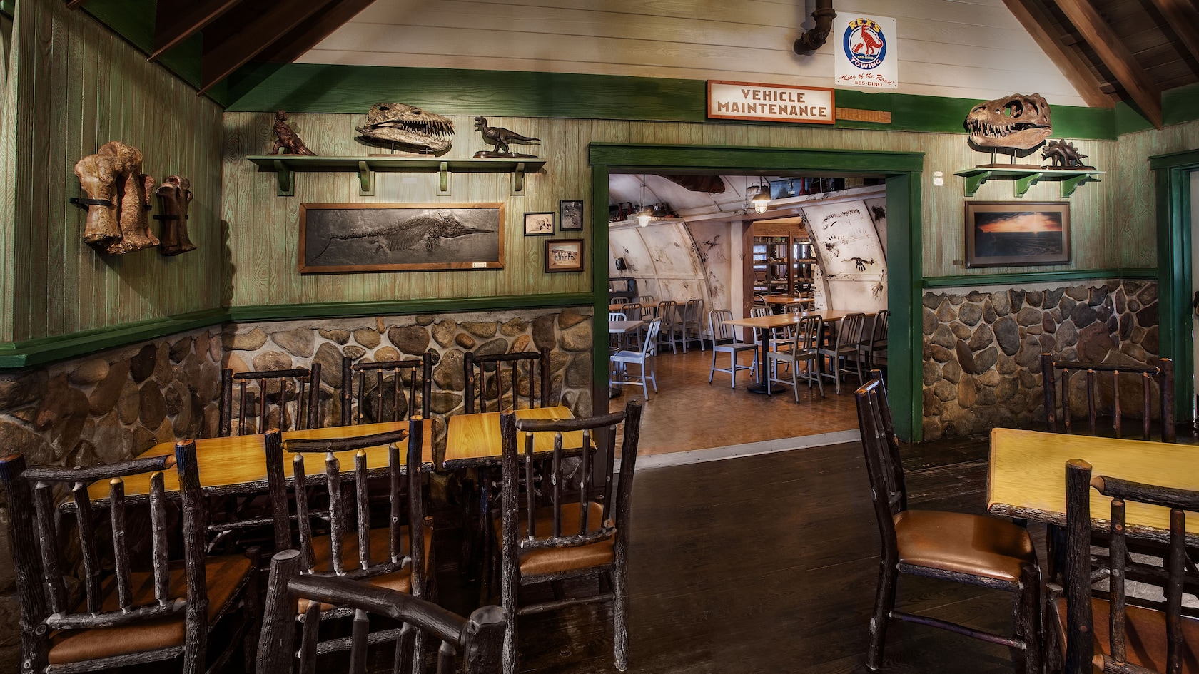 Restaurantosaurus 'visitor center' dining area with dinosaur relics on the walls