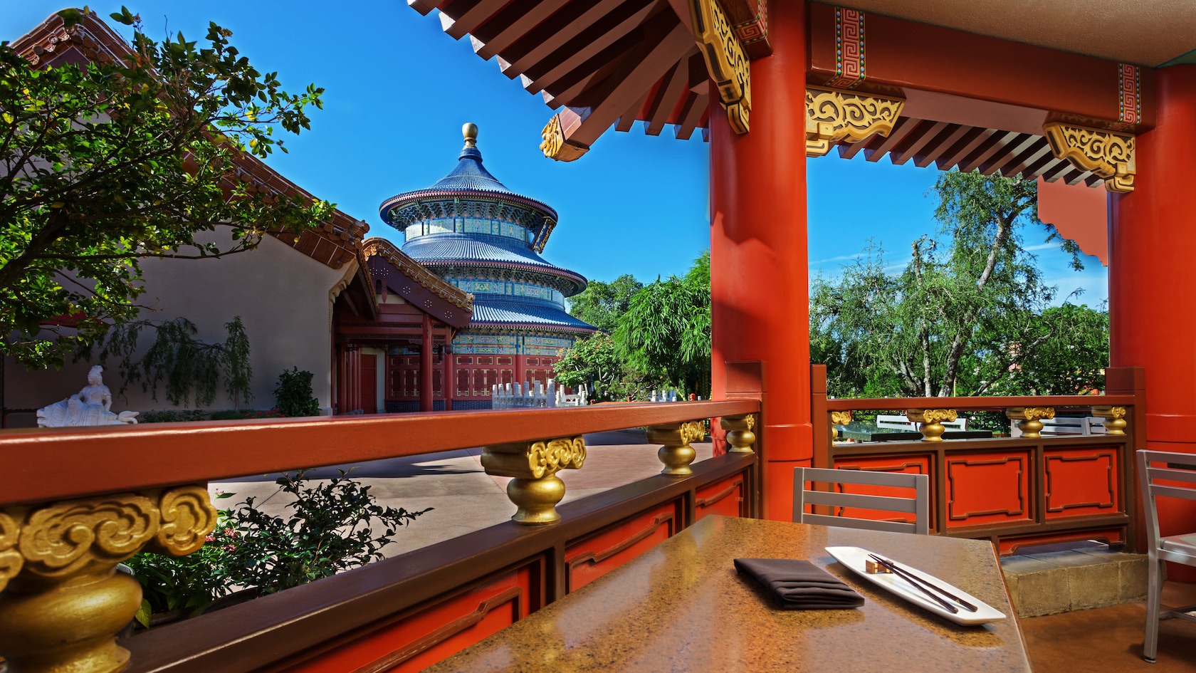 Open-air dining area at Lotus Blossom Café with view of the 3-tiered Temple of Heaven