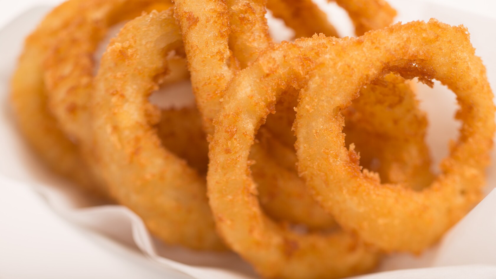 A stack of fried onion rings