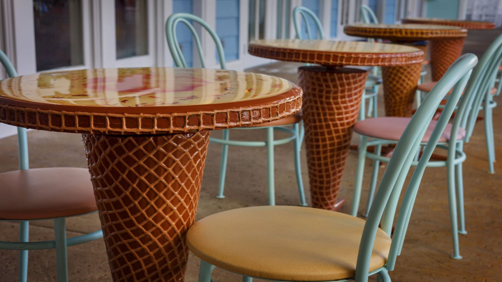 Ice cream cone-shaped tables and wrought-iron chairs