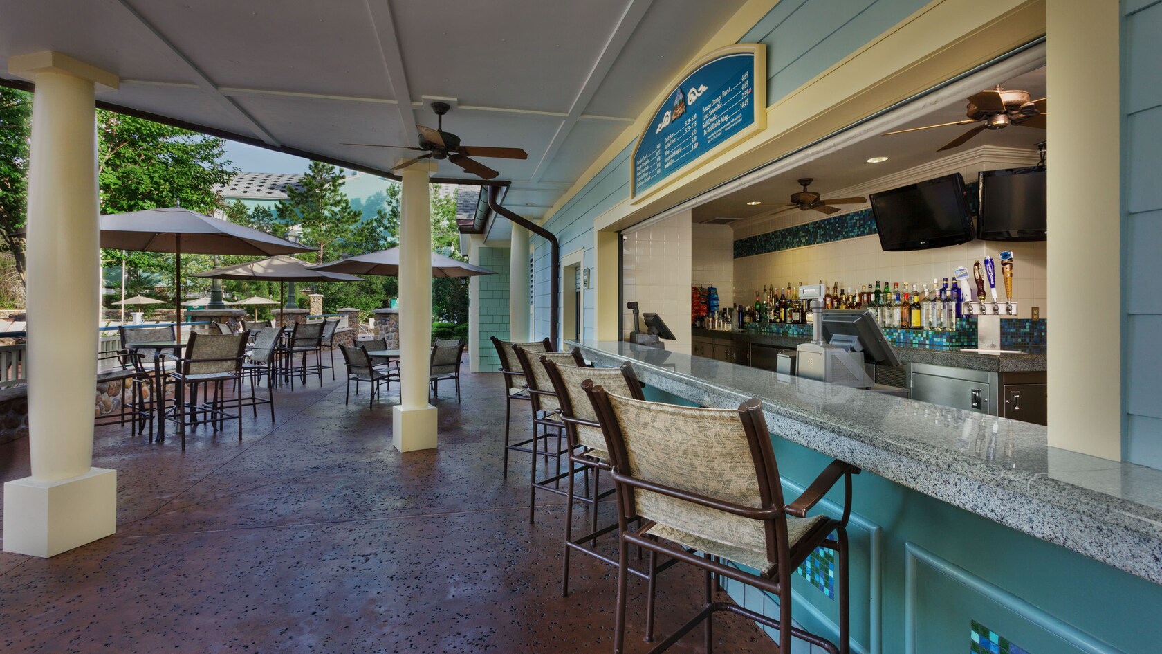 Side view of covered patio bar chair-stools and counter