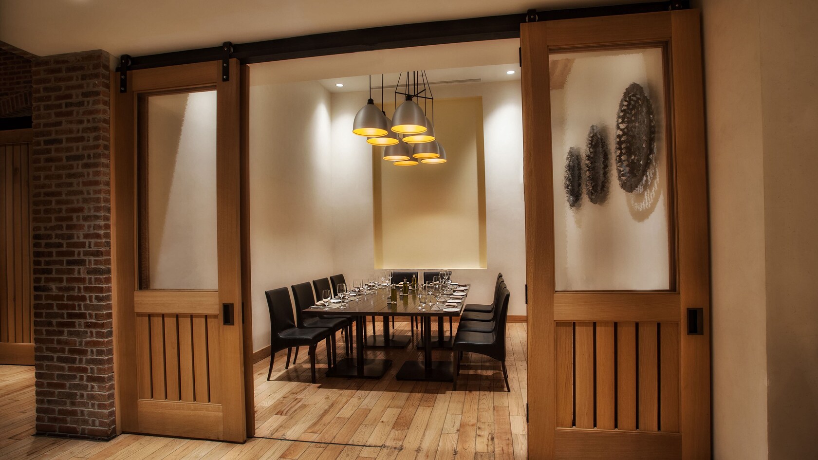 A private dining room behind sliding wood-paneled doors