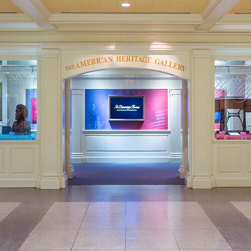 Entrance to The American Heritage Gallery at Epcot flanked by windows