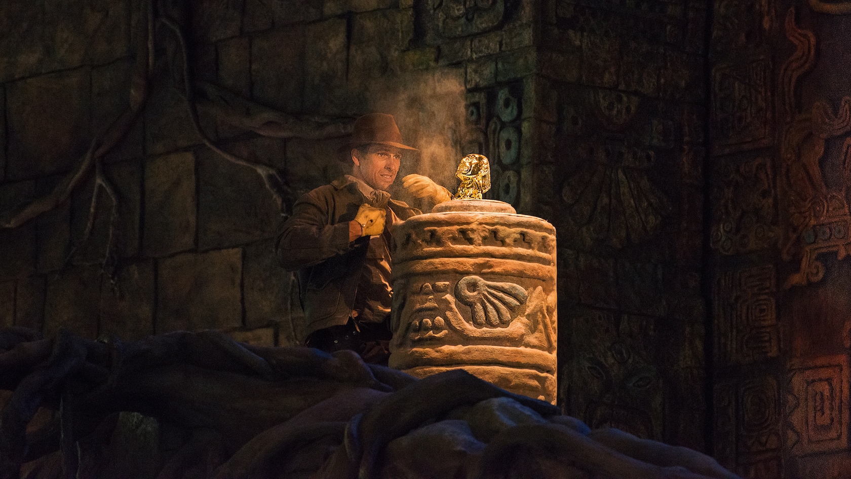 Indiana Jones stands by the golden idol from Raiders of the Lost Ark