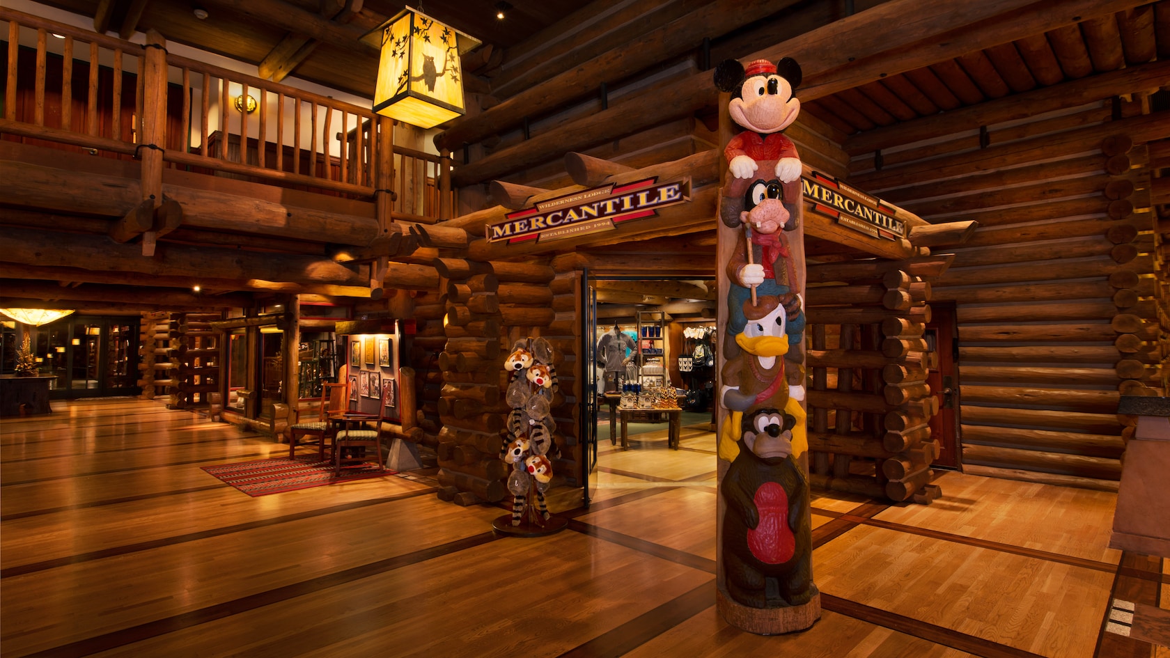 A totem pole of Disney characters at the entrance of Wilderness Lodge Mercantile