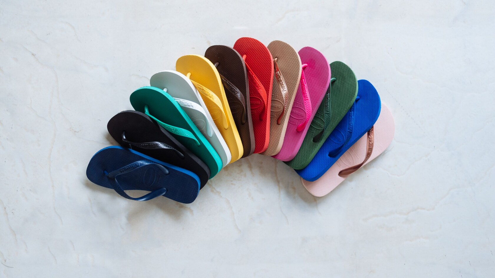 Twelve flip flops arranged in an arch
