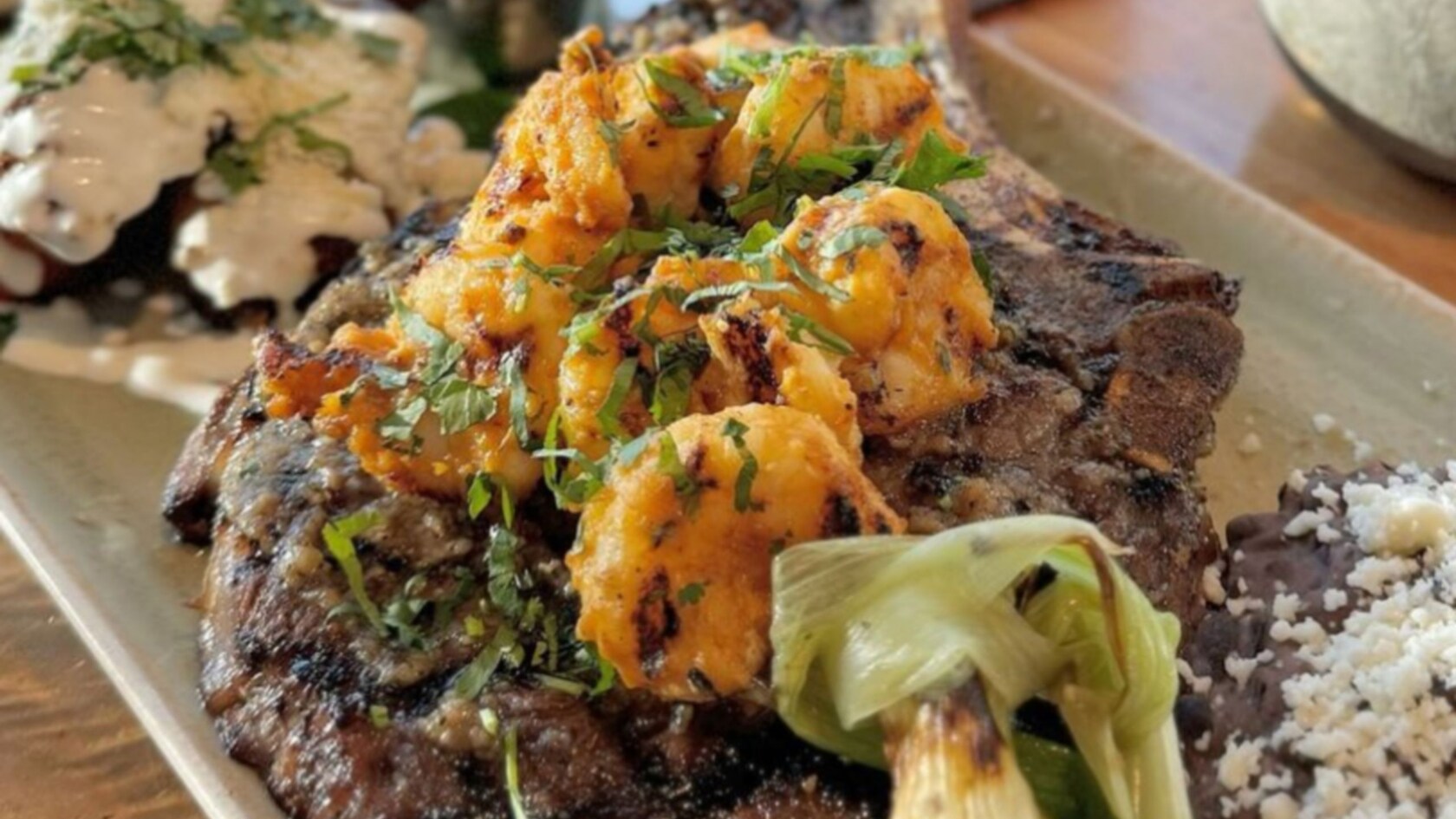 A plate of Carne Asada with shrimp from Frontera Cocina