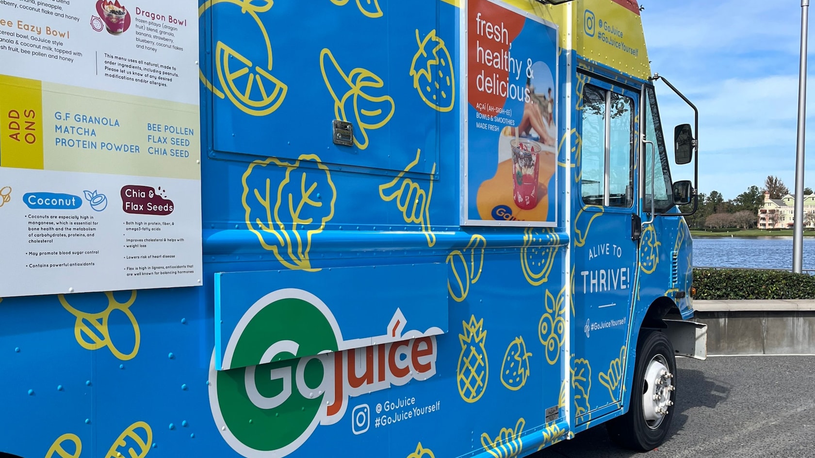 A GoJuice food truck parked near a body of water