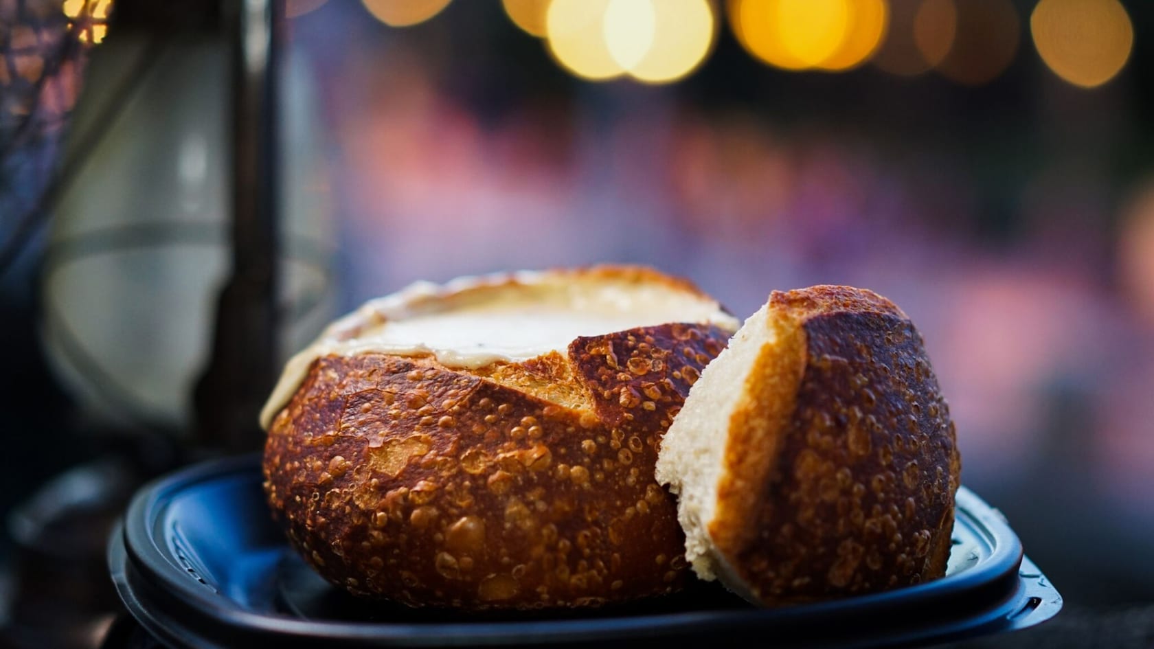 A tray with Soup in Sourdough Bread Bowl from Royal Street Veranda