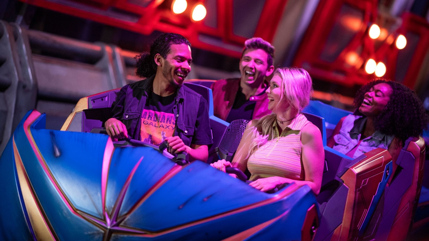 4 Guests laughing after riding Guardians of the Galaxy: Cosmic Rewind