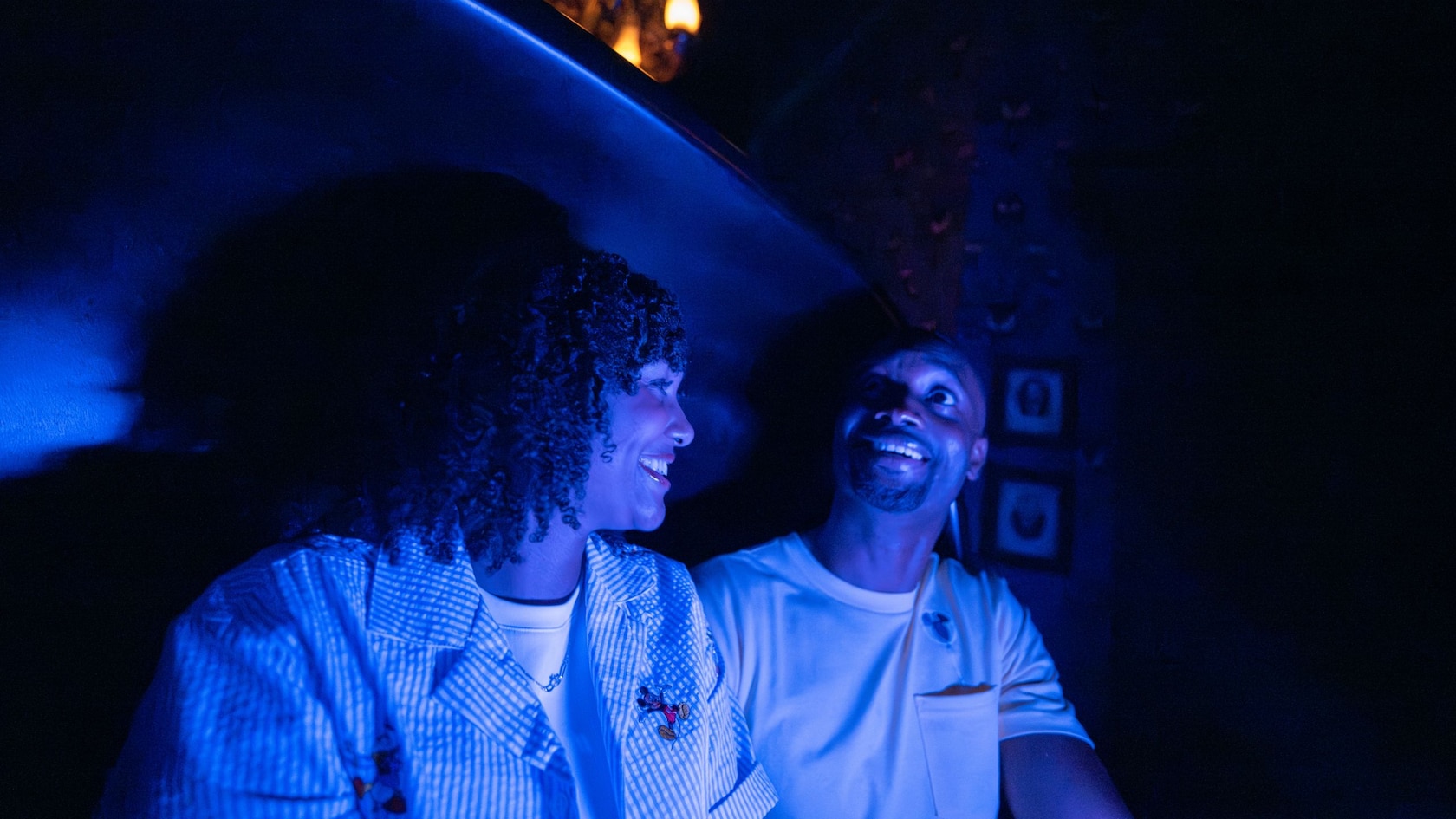 Guests riding the Haunted Mansion attraction at Magic Kingdom park