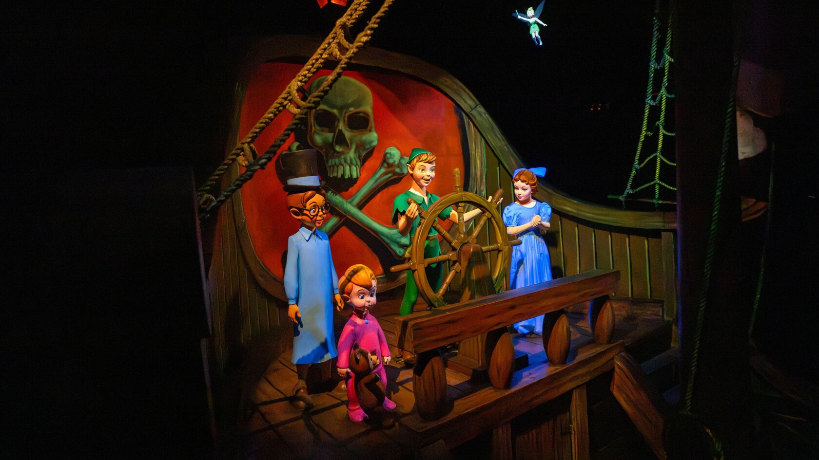 The Darling siblings, Peter Pan and Tinker Bell in the Peter Pan's Flight ride at Magic Kingdom park